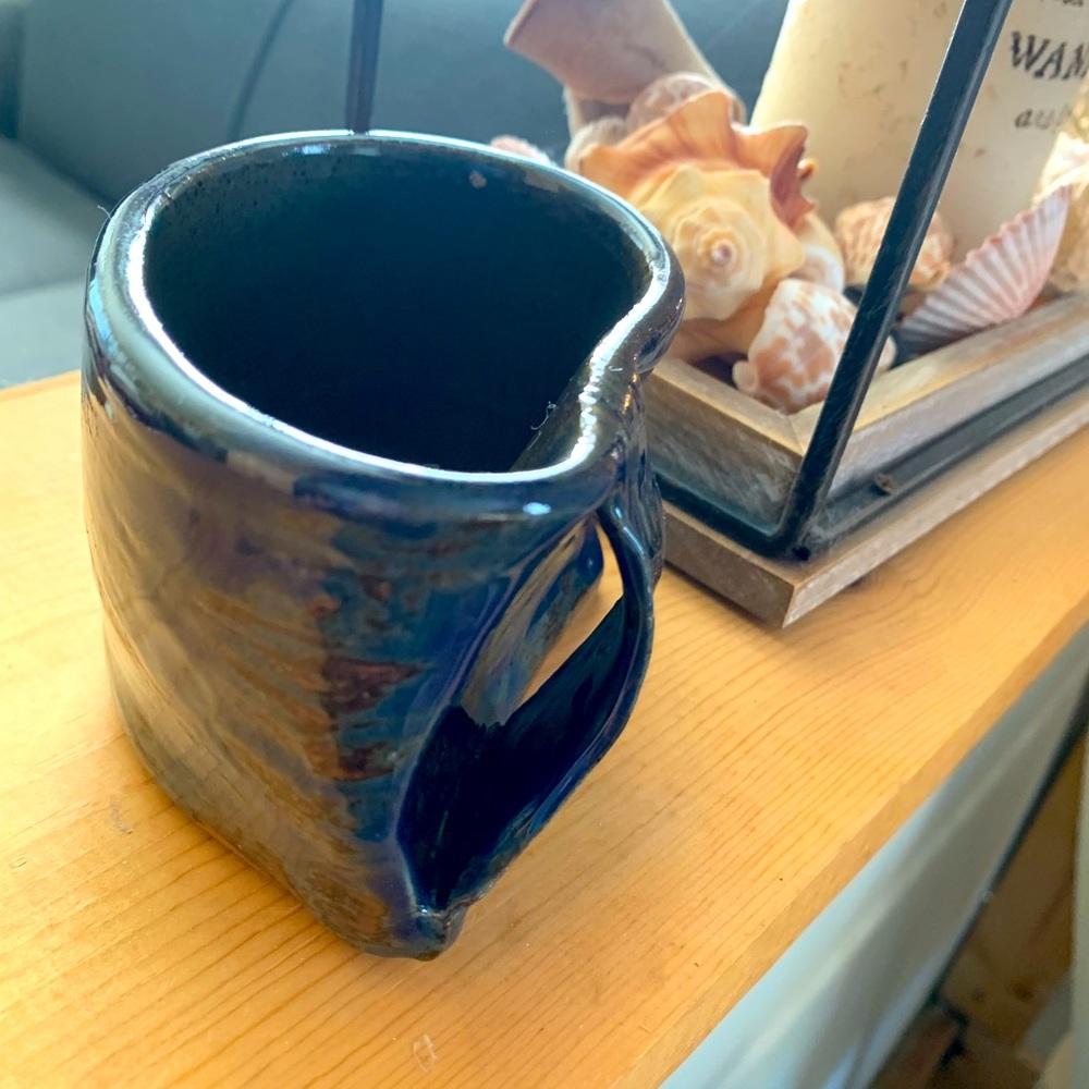 Handmade pottery coffee mug. Unique design in beautiful cobalt blue & mud color.